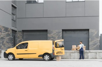 Small cargo van being loaded with boxes for Seattle studio apartment move in Capitol Hill