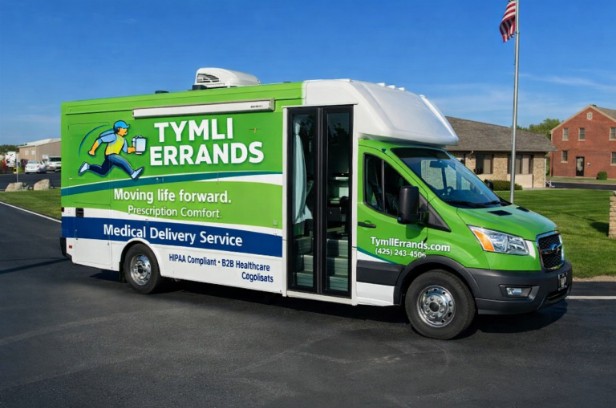 Medical courier cargo van preparing same-day healthcare delivery at Seattle clinic loading dock.
