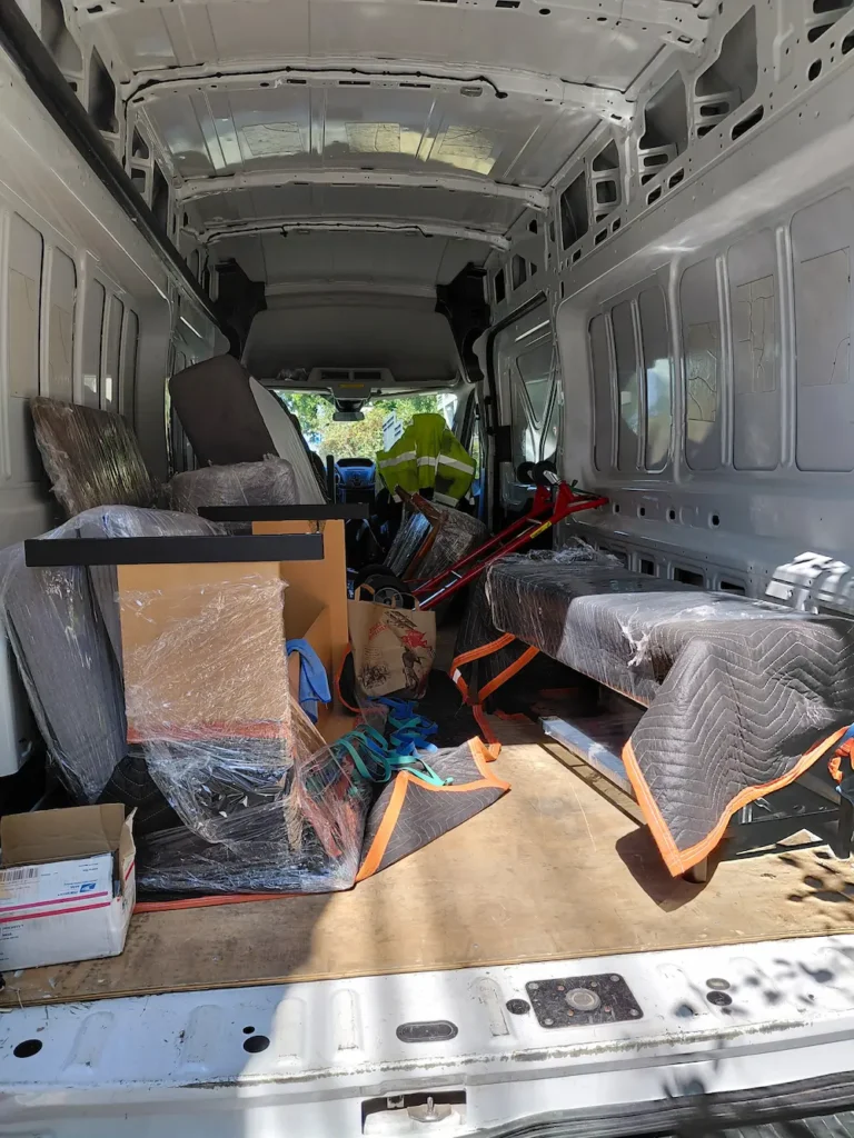 TYMLI small move from University District Seattle with wrapped furniture loaded for transport.