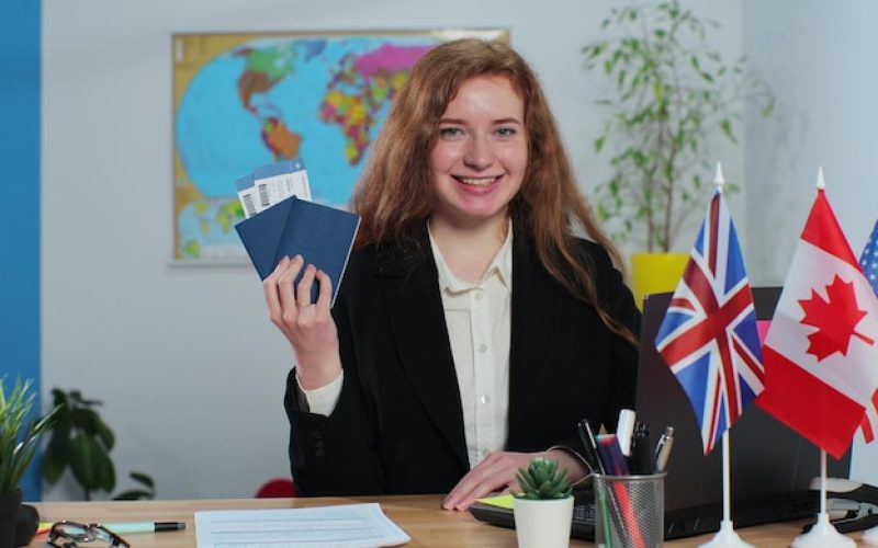 portrait-woman-travel-agent-travel-agency-with-passports-tickets-travelling-concept_299057-2077